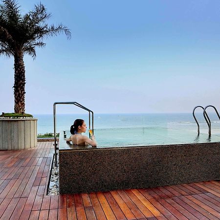 Novotel Visakhapatnam Varun Beach Экстерьер фото Infinity pool at the hotel